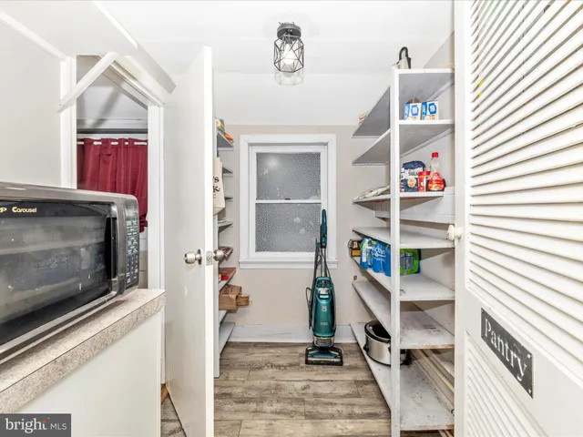 a view of a livingroom with furniture and staircase