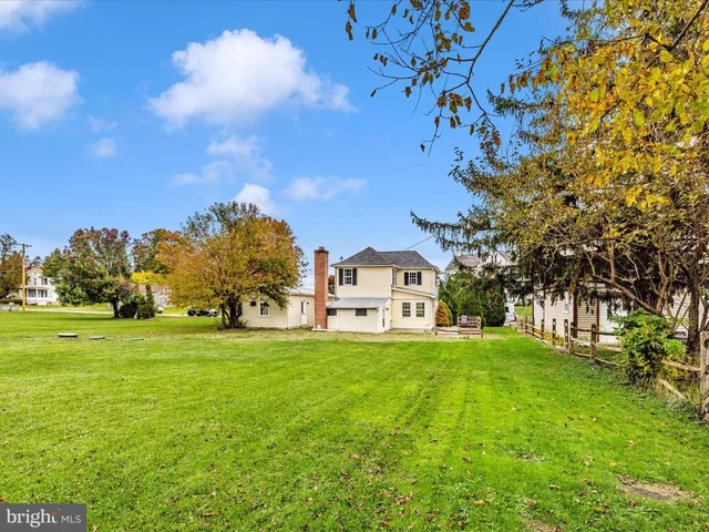 a view of a house with a big yard