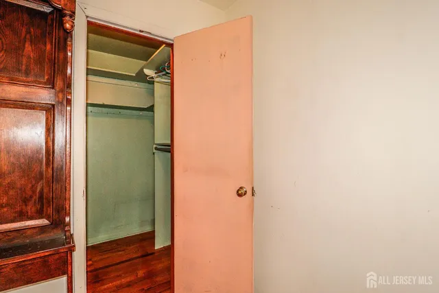 a bathroom with a glass door shower and a sink