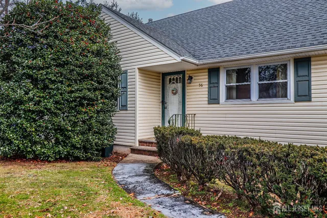 a view of a house with potted plants