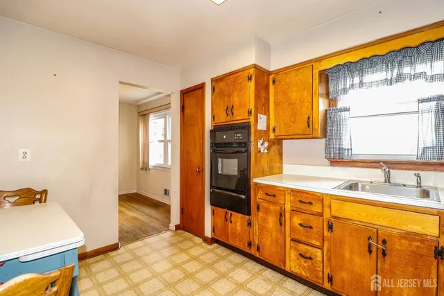 a spacious bathroom with a double vanity sink and a mirror