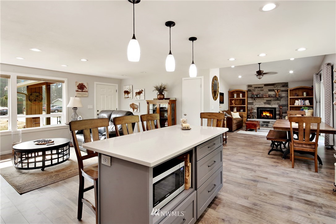 1064 West Laurel Road Ferndale, WA 98248 - Photo 12 of 39 a large kitchen with a table and chairs