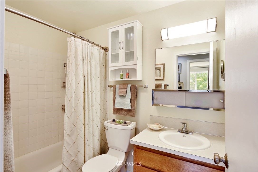 1064 West Laurel Road Ferndale, WA 98248 - Photo 16 of 39 a bathroom with a sink toilet and shower
