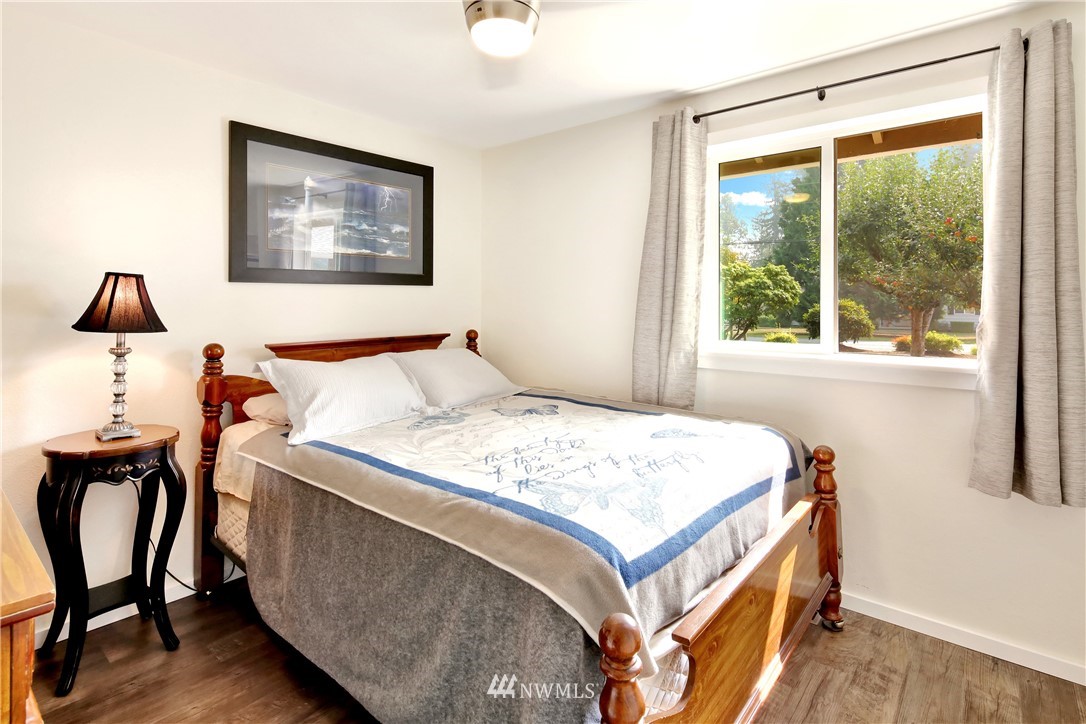 1064 West Laurel Road Ferndale, WA 98248 - Photo 21 of 39 a bedroom with a bed and a table