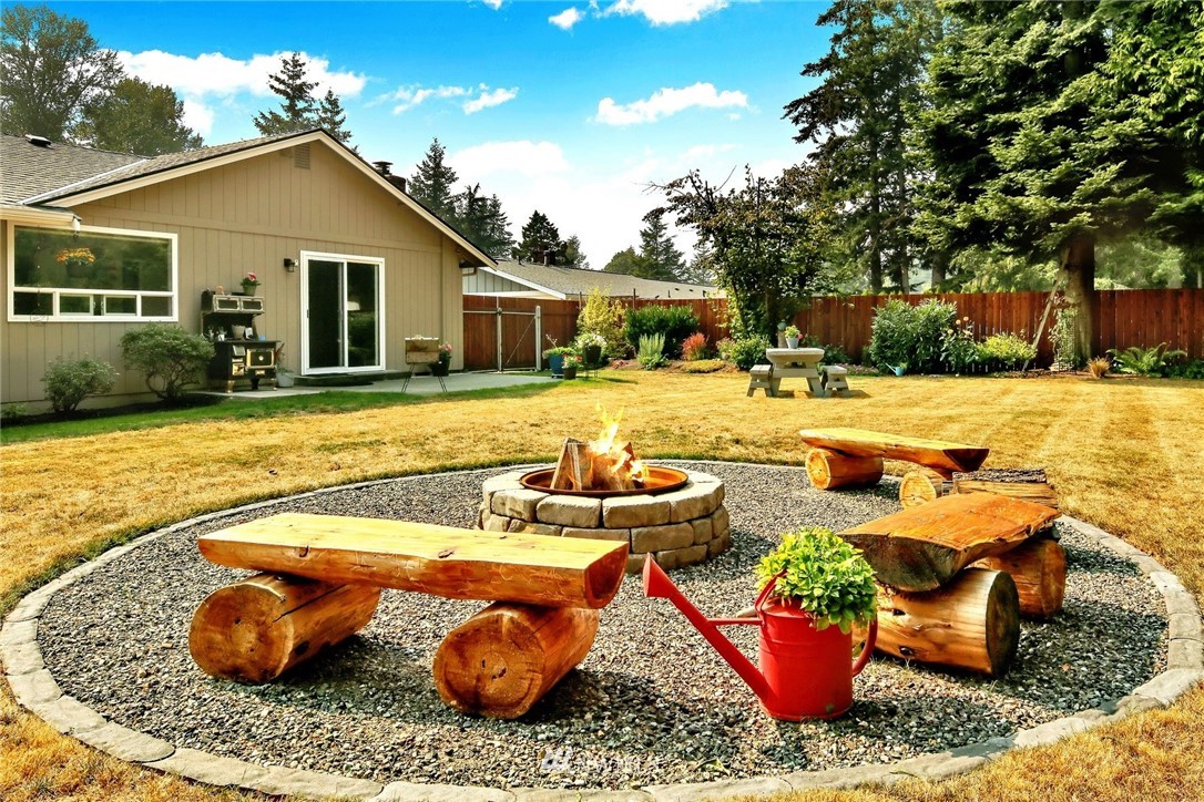 1064 West Laurel Road Ferndale, WA 98248 - Photo 30 of 39 a view of a house with swimming pool and sitting area