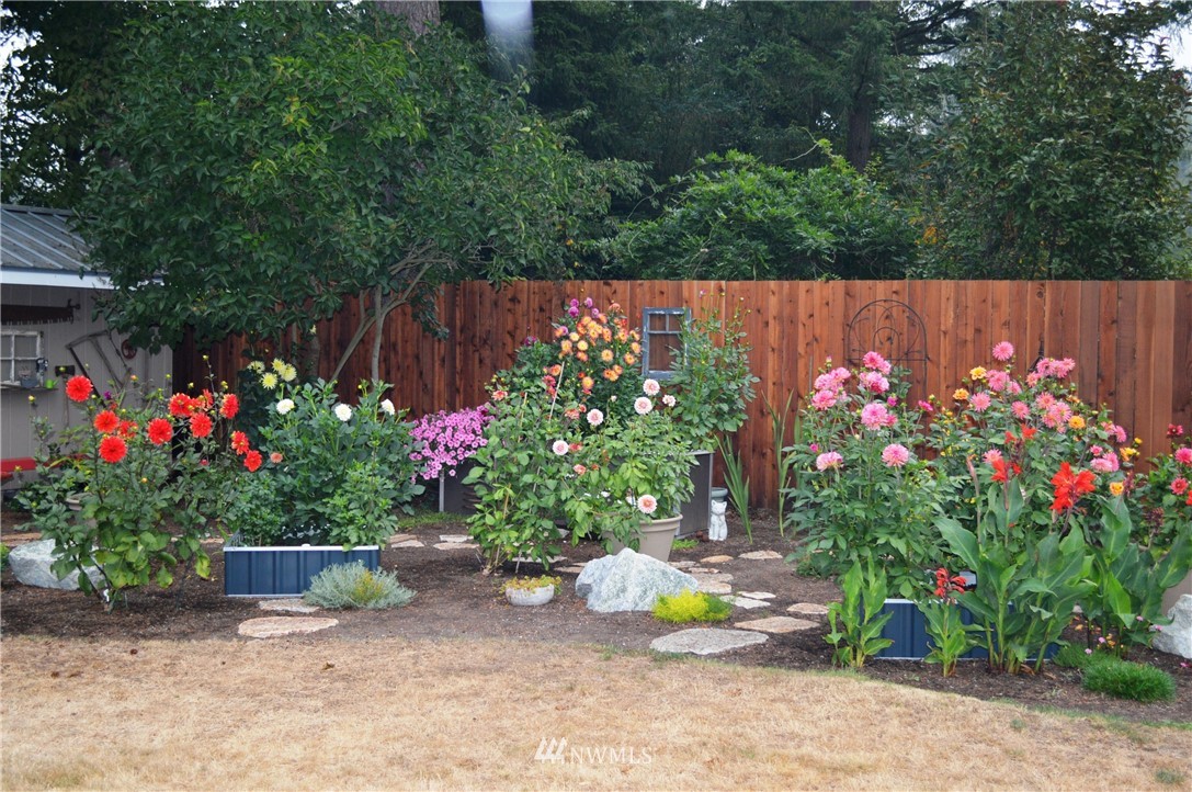 1064 West Laurel Road Ferndale, WA 98248 - Photo 32 of 39 a view of garden with flowers and trees