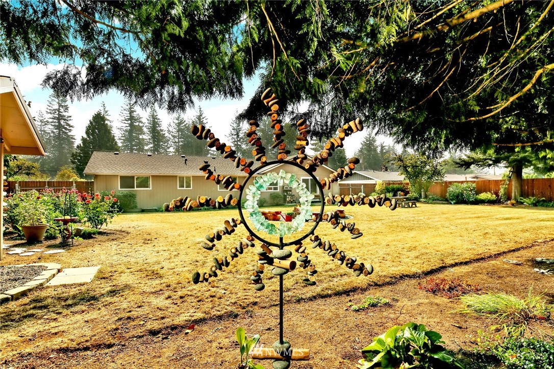 1064 West Laurel Road Ferndale, WA 98248 - Photo 37 of 39 a view of a yard with yellow lighting