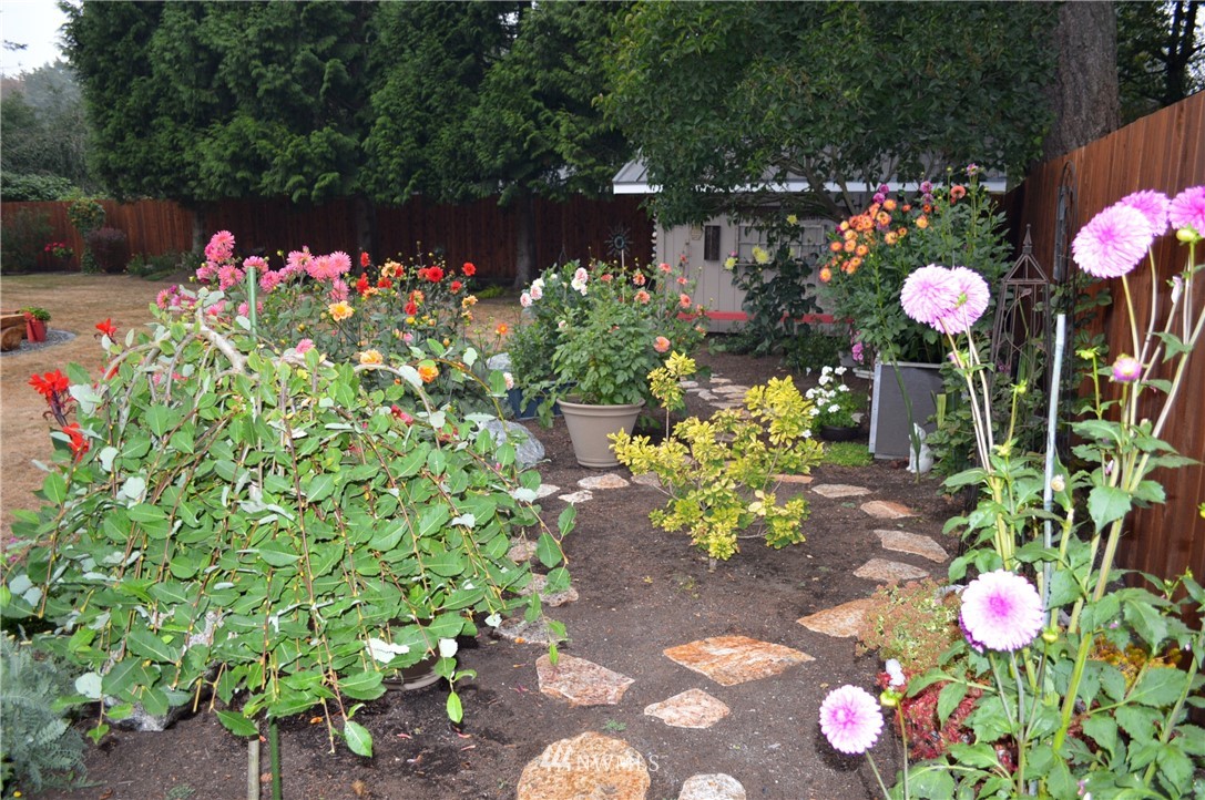 1064 West Laurel Road Ferndale, WA 98248 - Photo 38 of 39 a street view with flowers and trees