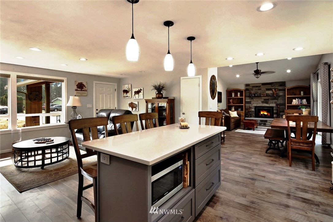 1064 West Laurel Road Ferndale, WA 98248 - Photo 8 of 39 a large kitchen with a table and chairs