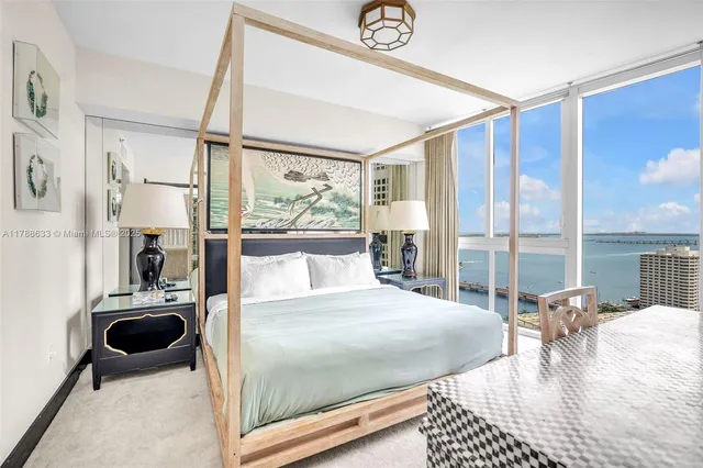 a room with a bed a table and chairs