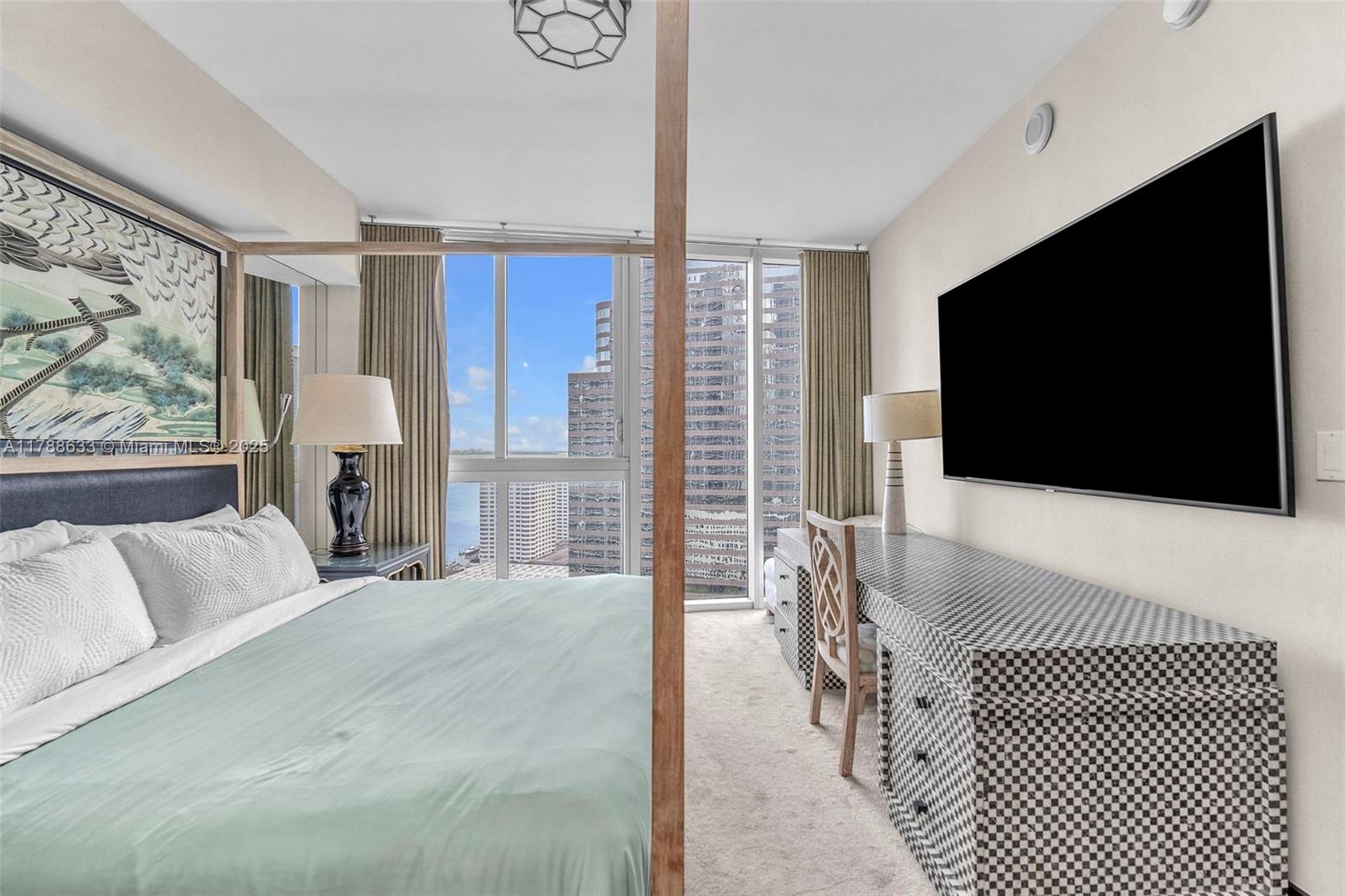 485 Brickell Avenue, Unit 2508 Miami, FL 33131 - Photo 11 of 20 a living room with a large window and a flat screen tv