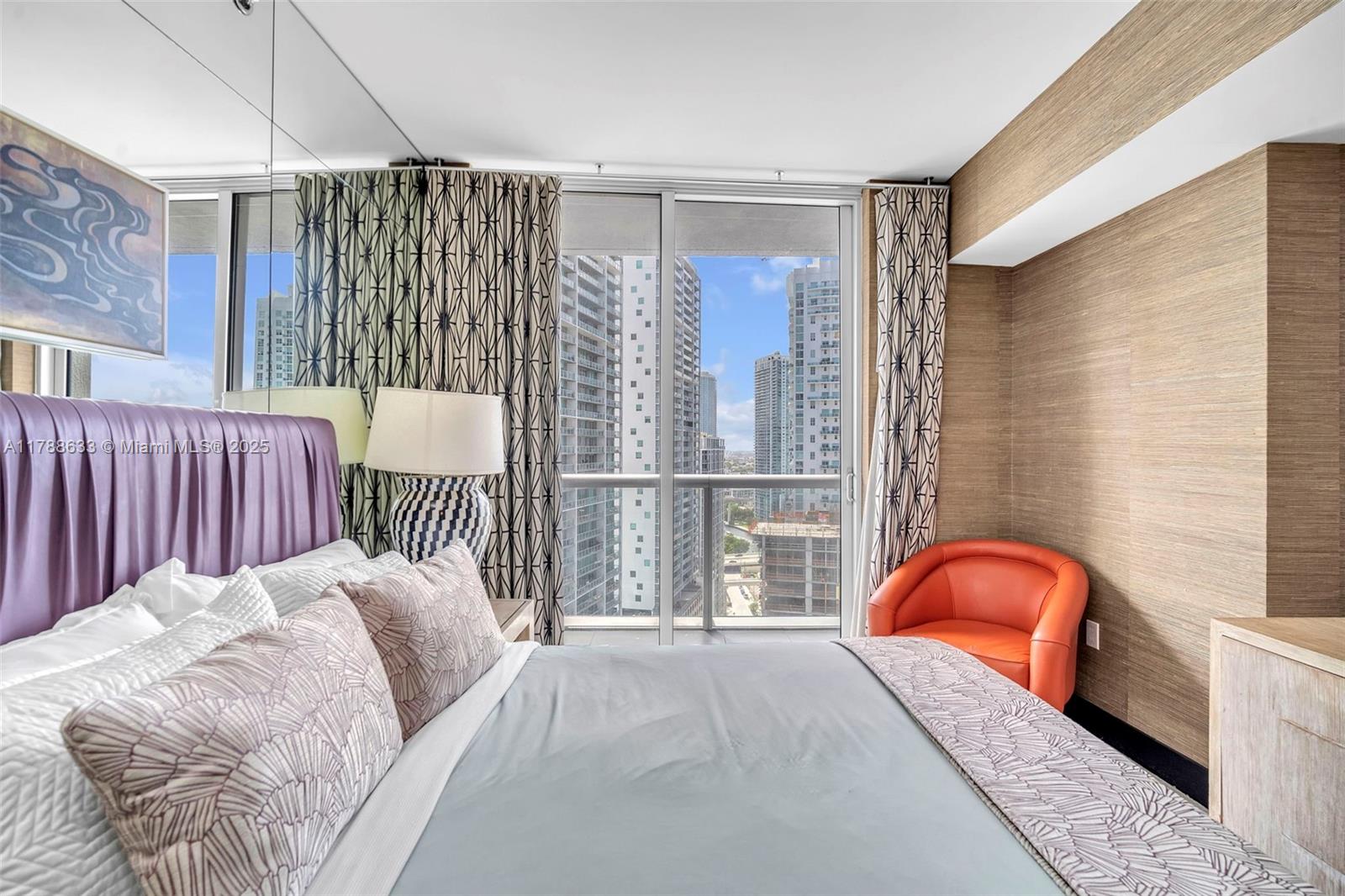 485 Brickell Avenue, Unit 2508 Miami, FL 33131 - Photo 13 of 20 a bedroom with a bed and a window