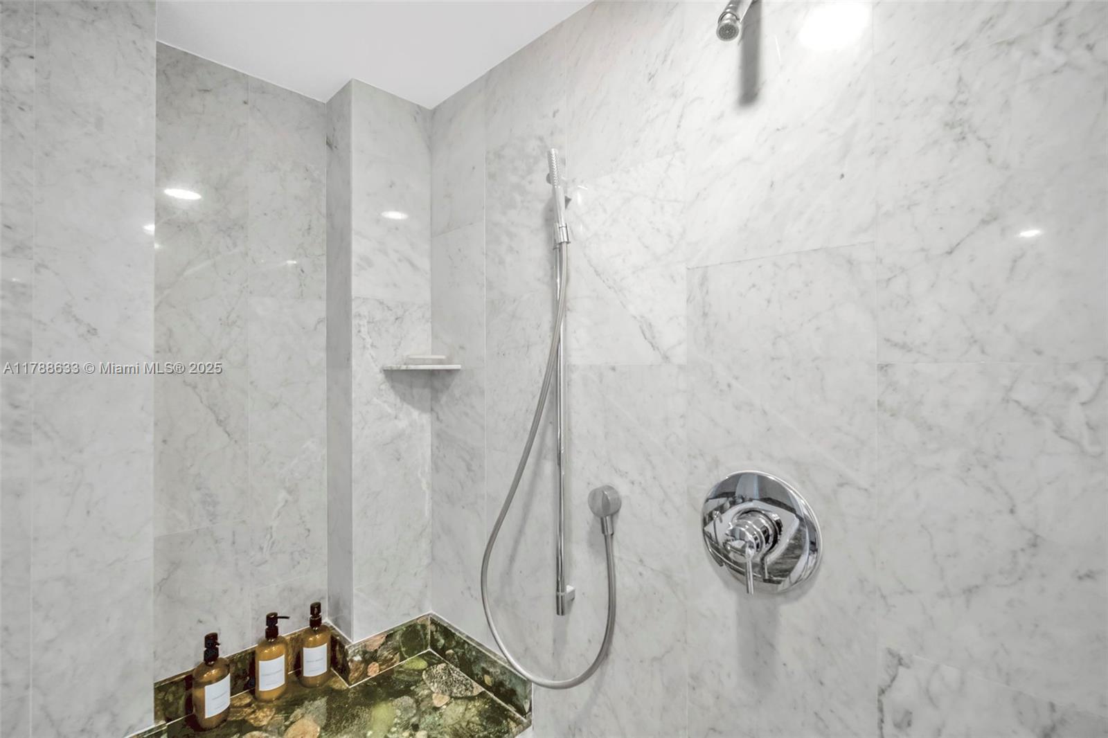 485 Brickell Avenue, Unit 2508 Miami, FL 33131 - Photo 15 of 20 a bathroom with a sink and a mirror