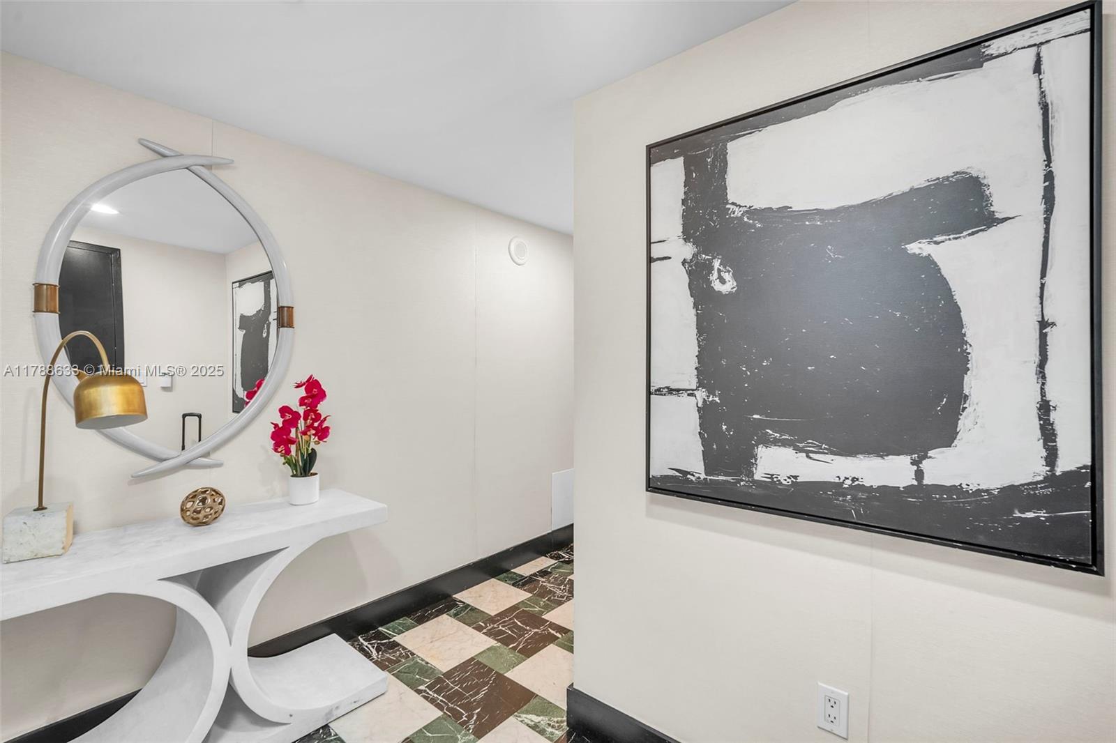 485 Brickell Avenue, Unit 2508 Miami, FL 33131 - Photo 18 of 20 a bathroom with a sink mirror and vanity