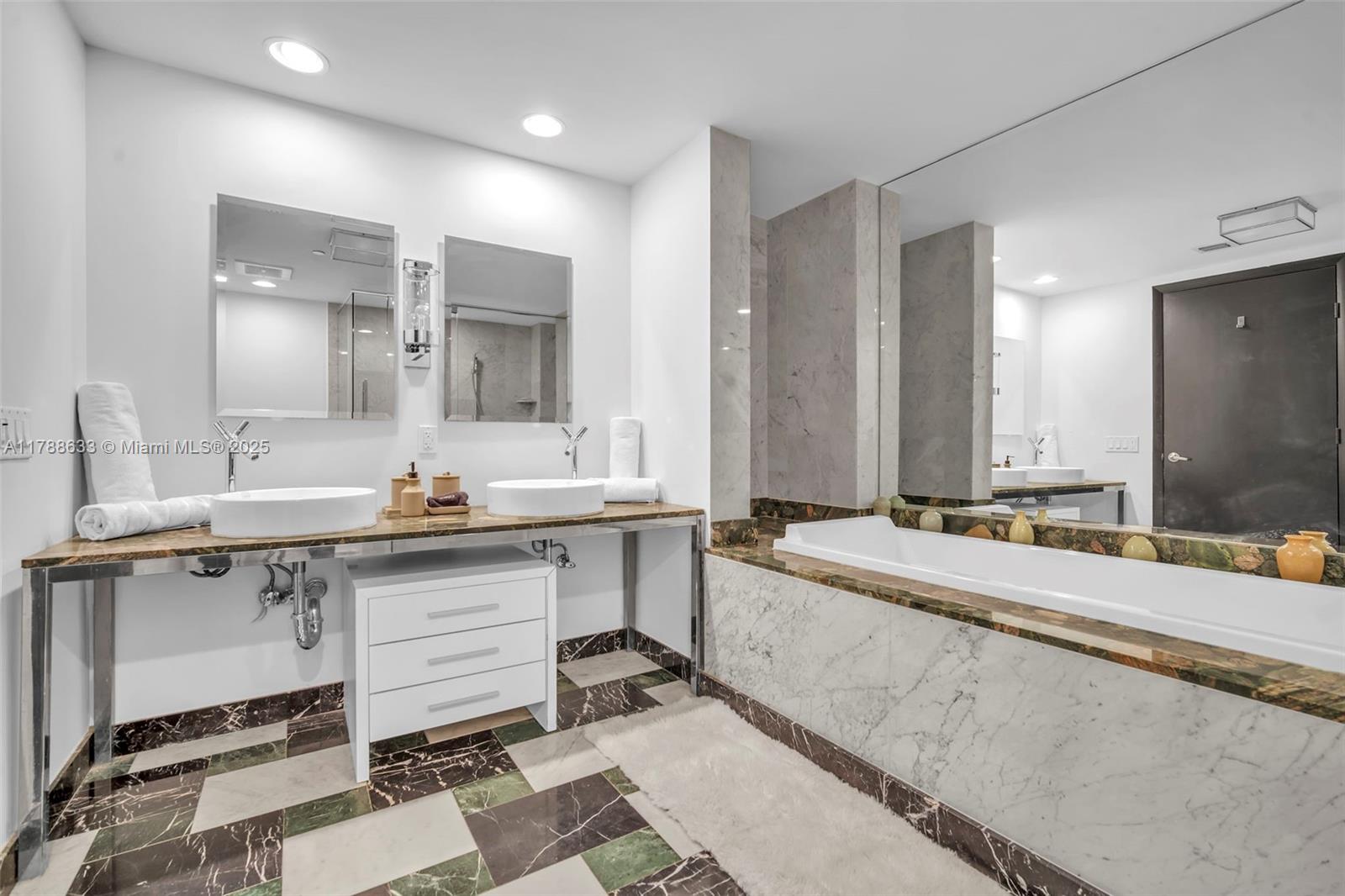 485 Brickell Avenue, Unit 2508 Miami, FL 33131 - Photo 19 of 20 a large bathroom with a sink and a mirror