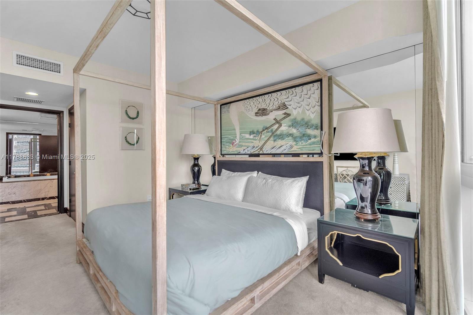 485 Brickell Avenue, Unit 2508 Miami, FL 33131 - Photo 10 of 20 a bedroom with a balcony a bed and a painting on the wall