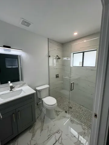 a bathroom with a toilet a sink and a bathtub