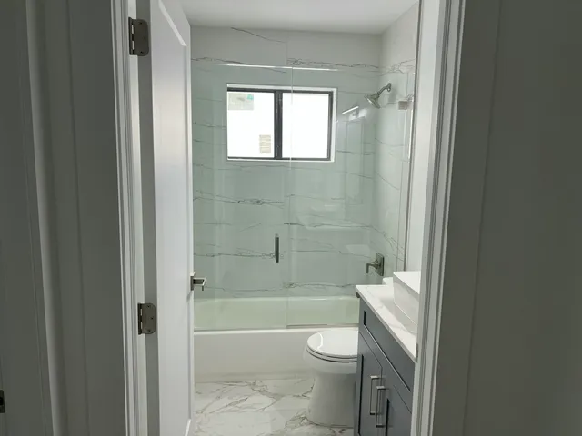 a bathroom with a shower and a bathtub