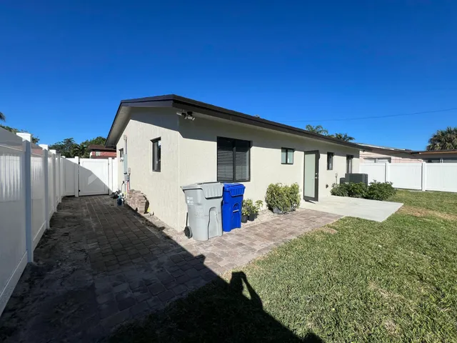 a house view with a backyard space