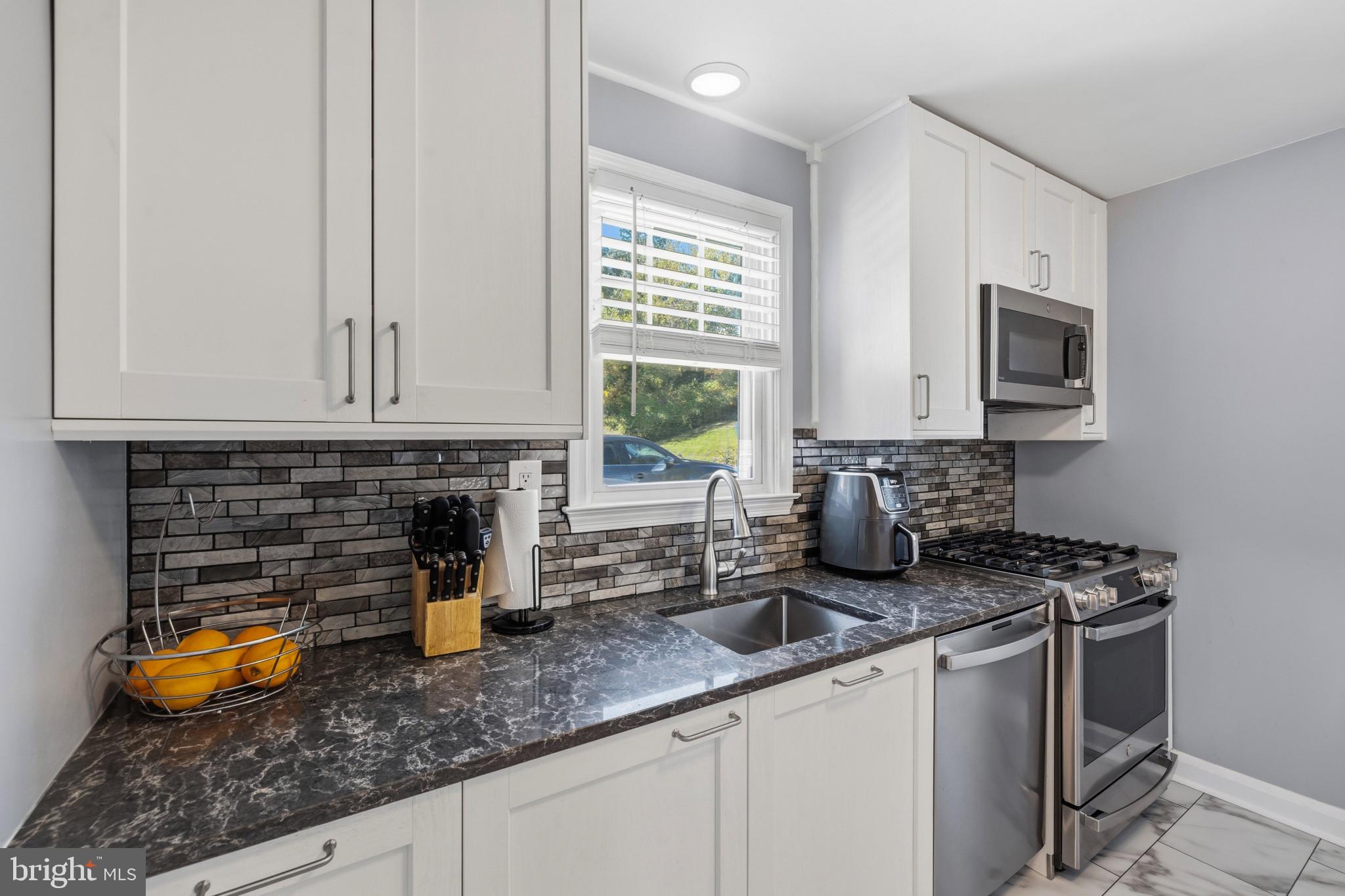 1246 Elm Road Baltimore, MD 21227 - Photo 6 of 27 Updated Kitchen with Quartz Countertops