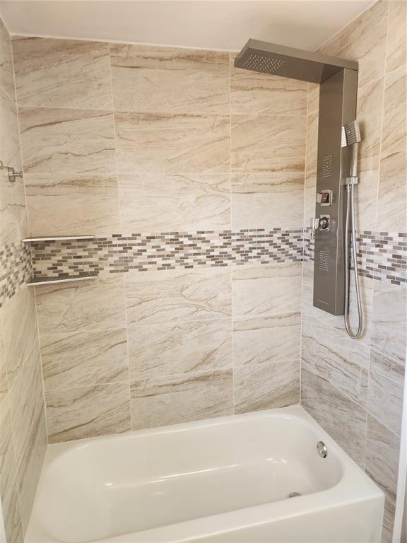 4462 Cynthia Lane Spring Hill, FL 34606 - Photo 14 of 22 a bathroom with bathtub and shower