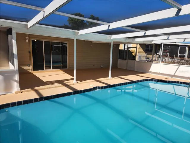 a view of swimming pool with an outdoor seating