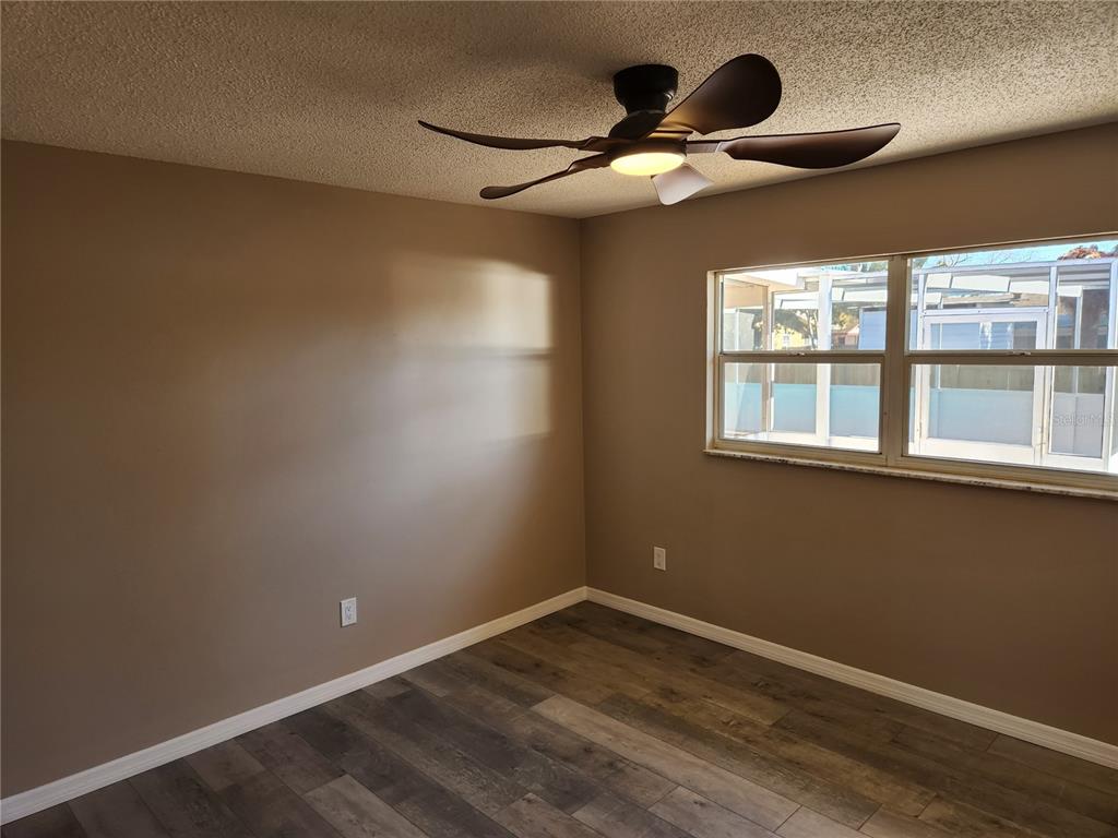 4462 Cynthia Lane Spring Hill, FL 34606 - Photo 9 of 22 a view of an empty room with a window