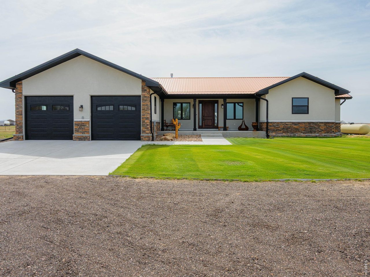 8626 County Road 22 Fort Lupton, CO 80621 - Photo 1 of 50 a view of a house with a yard and sitting area