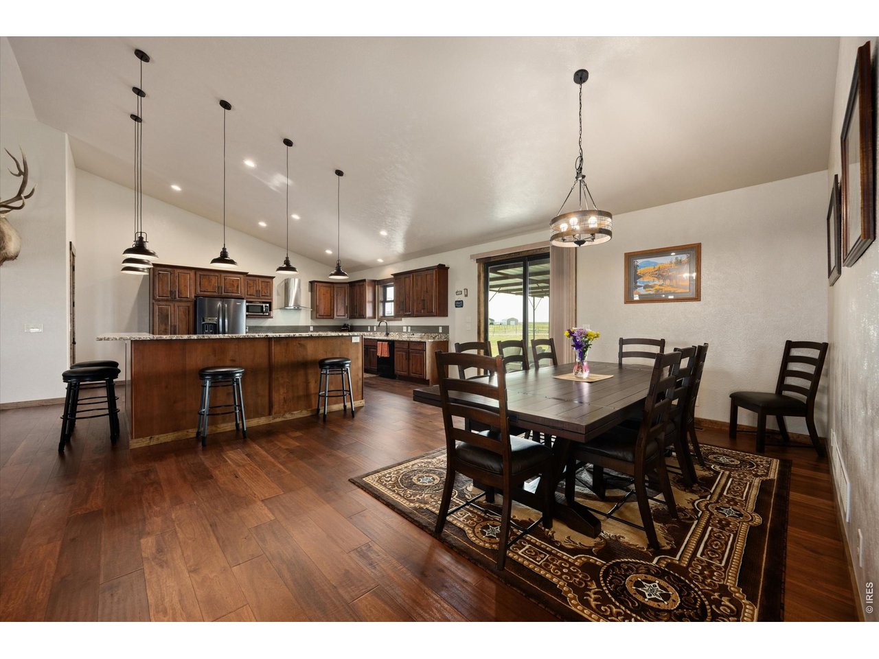 8626 County Road 22 Fort Lupton, CO 80621 - Photo 50 of 50 a view of a dining area with furniture and wooden floor