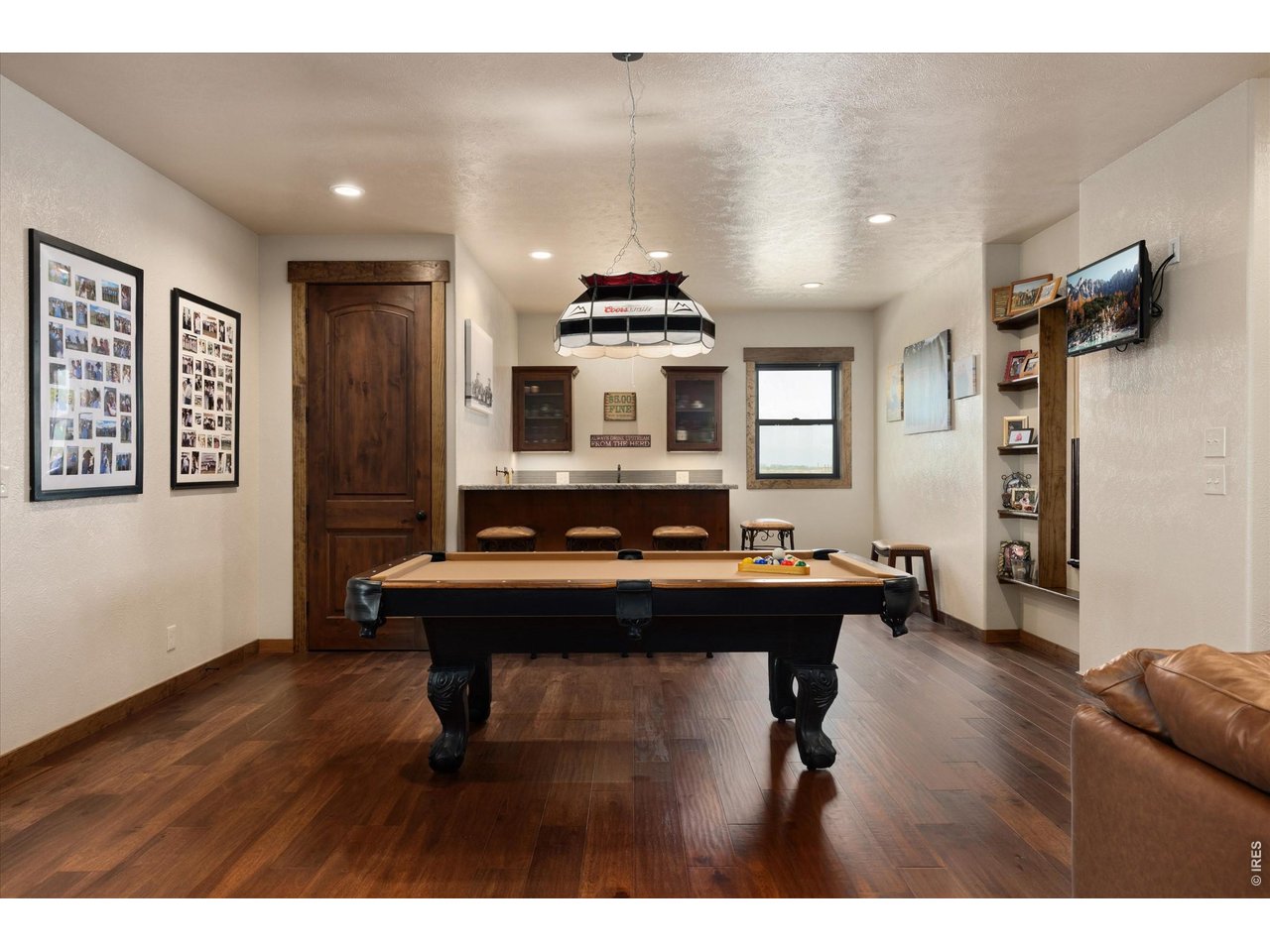 8626 County Road 22 Fort Lupton, CO 80621 - Photo 14 of 50 a living room with a table chairs and a kitchen view