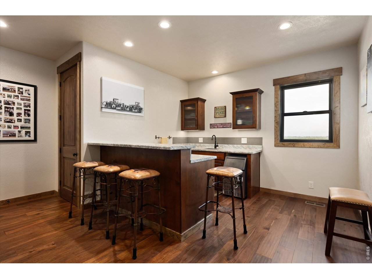 8626 County Road 22 Fort Lupton, CO 80621 - Photo 15 of 50 a view of a dining room with furniture and wooden floor