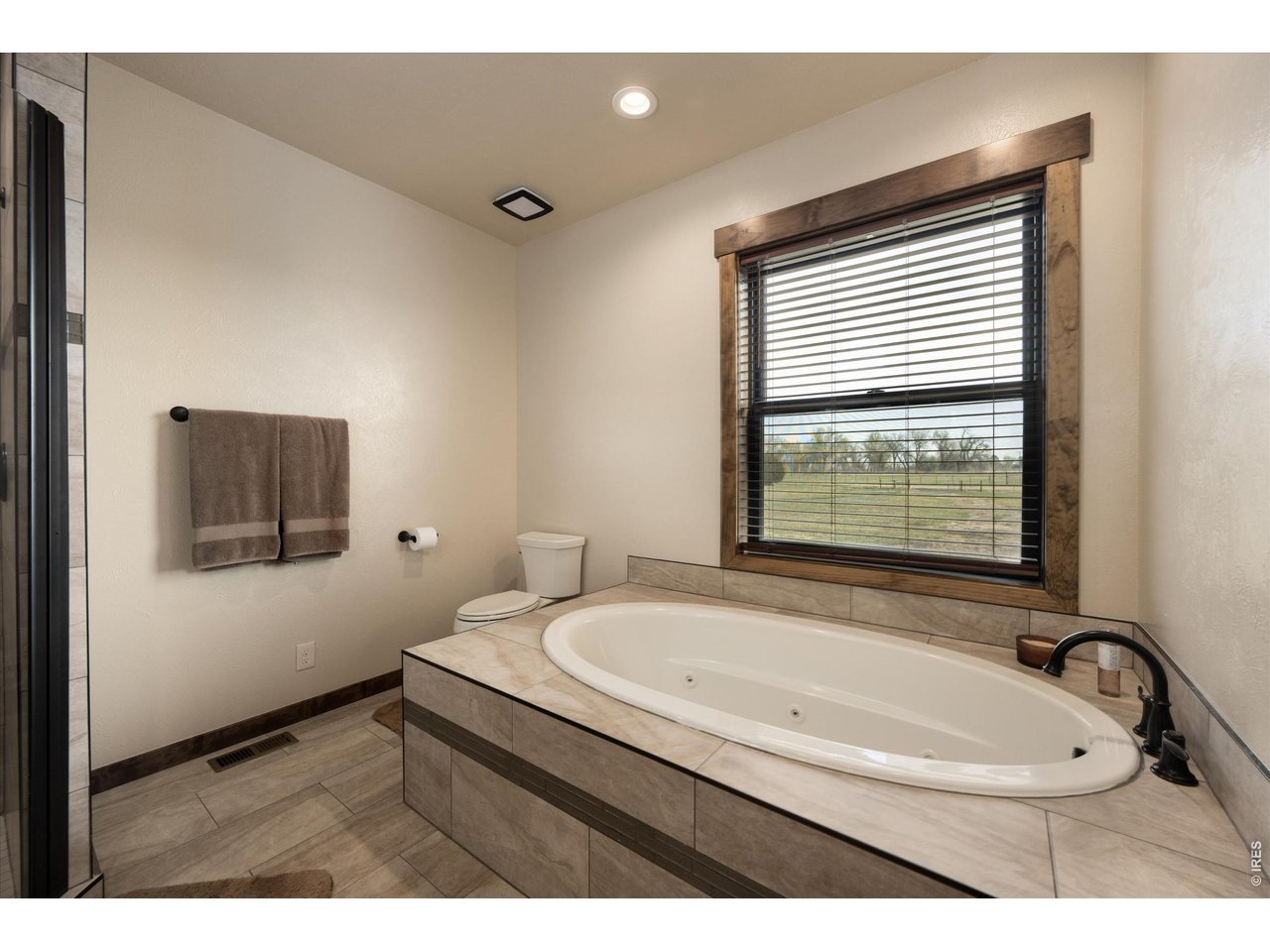 8626 County Road 22 Fort Lupton, CO 80621 - Photo 21 of 50 a bathroom with a sink and a bathtub