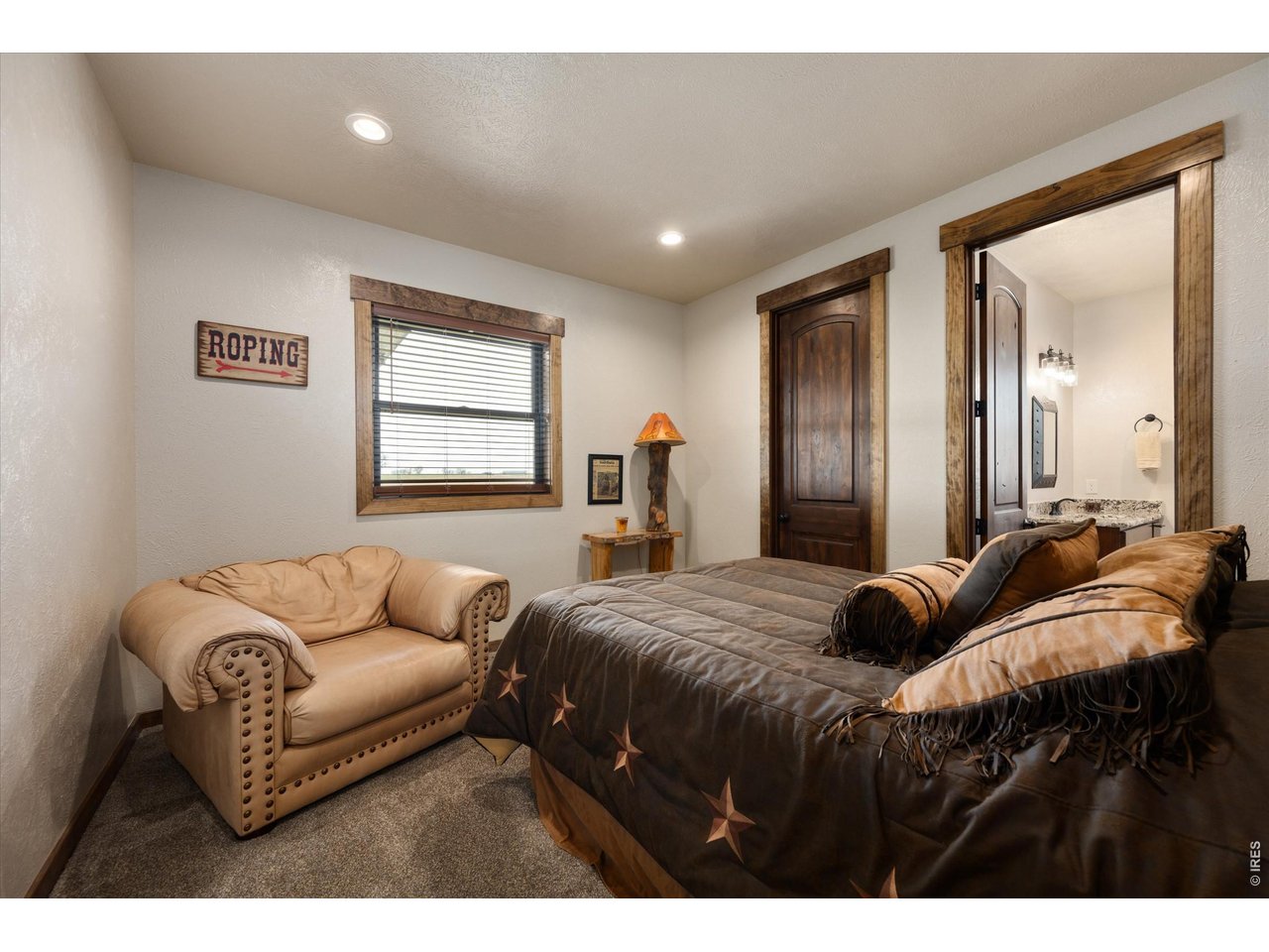 8626 County Road 22 Fort Lupton, CO 80621 - Photo 23 of 50 a bedroom with a bed and window