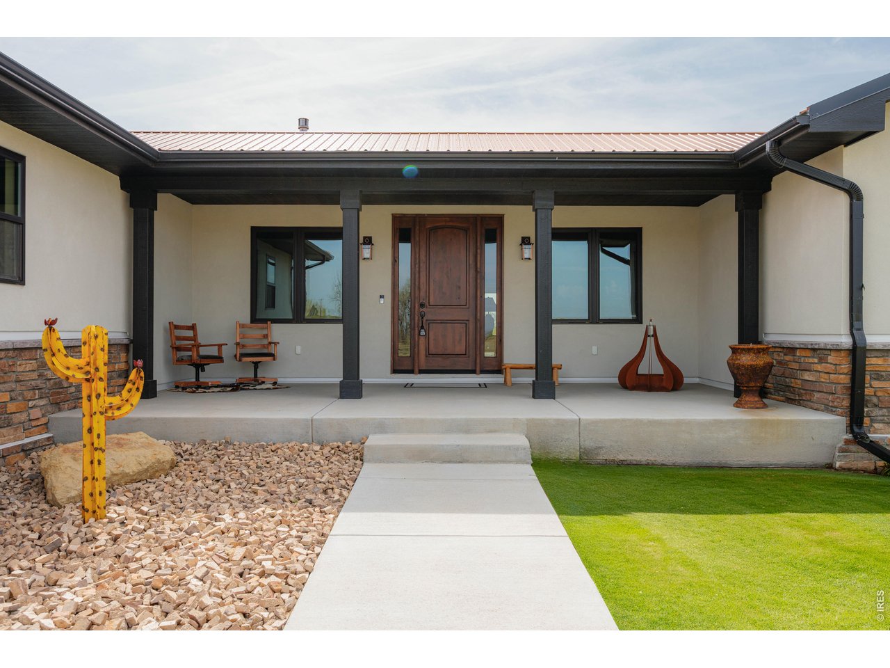 8626 County Road 22 Fort Lupton, CO 80621 - Photo 3 of 50 a view of a house with backyard porch and furniture