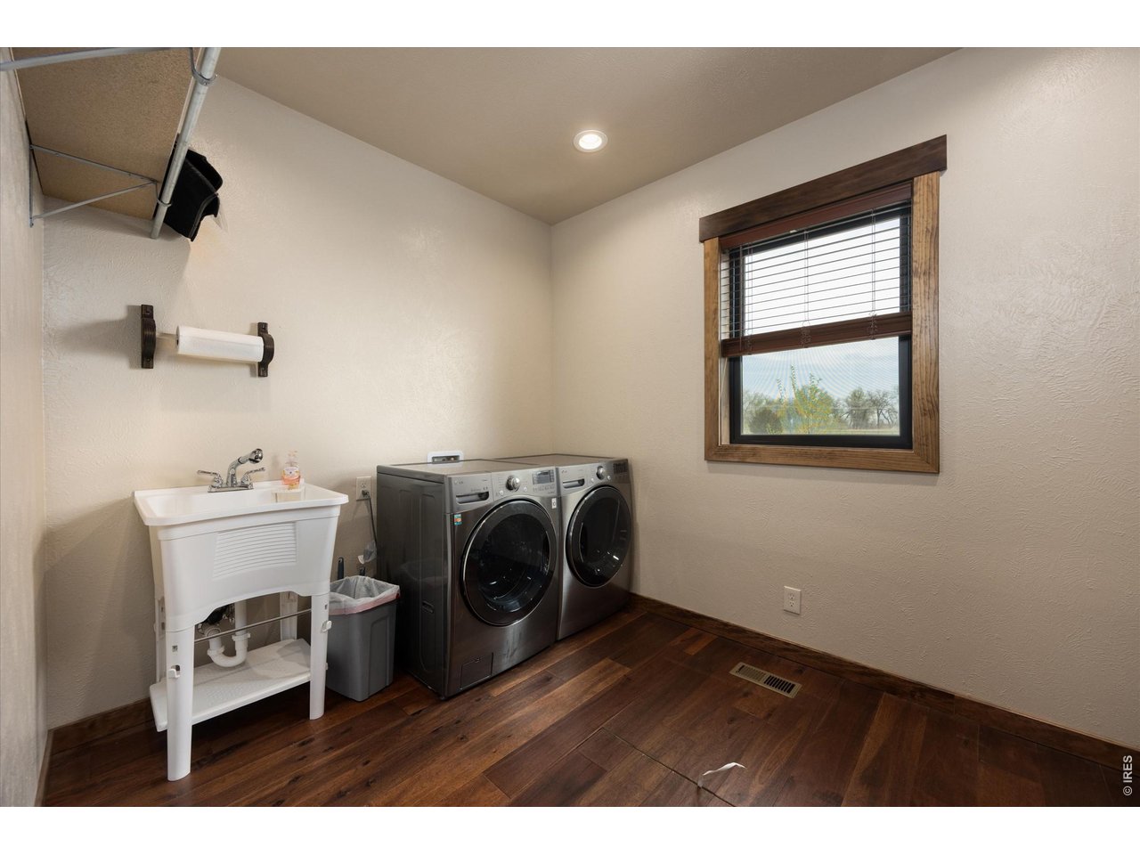 8626 County Road 22 Fort Lupton, CO 80621 - Photo 30 of 50 a view of storage and utility room with washer and dryer