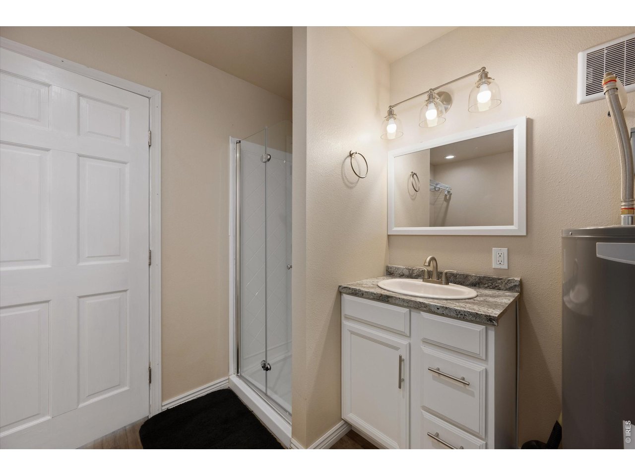 8626 County Road 22 Fort Lupton, CO 80621 - Photo 40 of 50 a bathroom with a granite countertop sink a mirror and a
