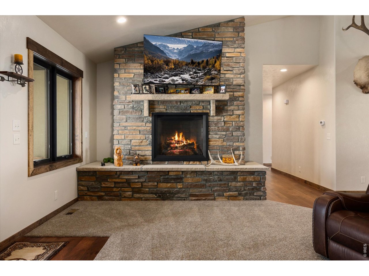 8626 County Road 22 Fort Lupton, CO 80621 - Photo 7 of 50 a living room with furniture and a fireplace
