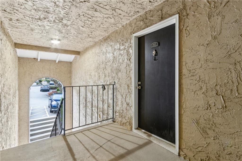 3155 Seven Pines, Unit 303 Atlanta, GA 30339 - Photo 3 of 25 a view of a wooden door and a window