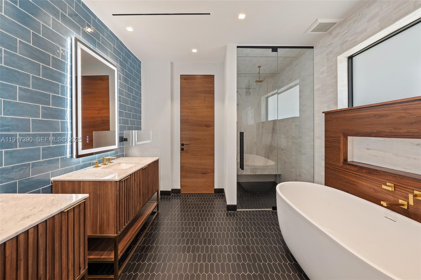 900 Washington Street Hollywood, FL 33019 - Photo 28 of 61 a bathroom with a sink a toilet a mirror and bathtub