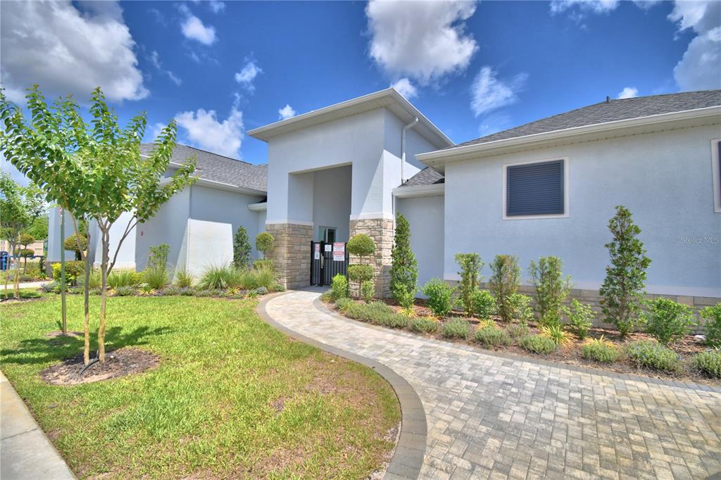 2839 Moulin Road Davenport, FL 33837 - Photo 71 of 75 a front view of a house with garden