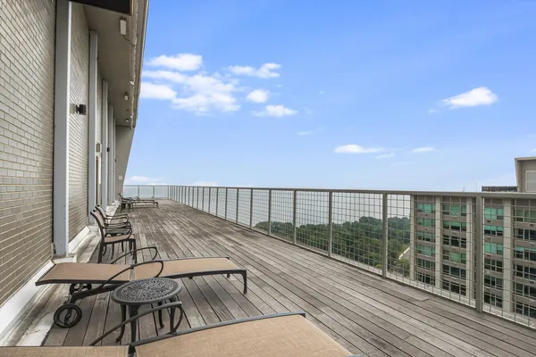 a view of a balcony with chairs