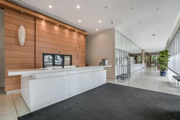 a kitchen with stainless steel appliances a sink and cabinets