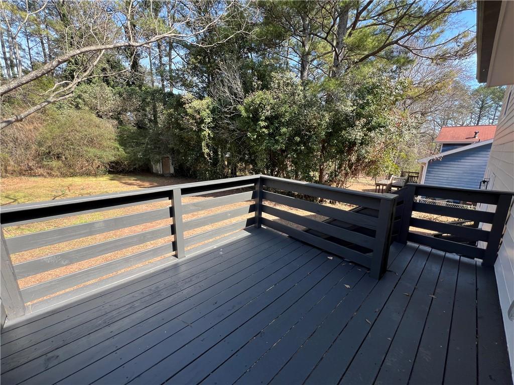5990 Wellborn Trace Lithonia, GA 30058 - Photo 13 of 56 a view of sitting area with large trees
