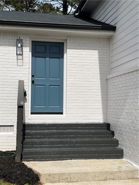 5990 Wellborn Trace Lithonia, GA 30058 - Photo 2 of 56 a view of house entrance