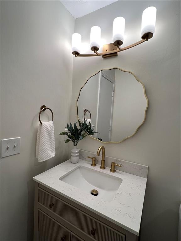 5990 Wellborn Trace Lithonia, GA 30058 - Photo 26 of 56 a bathroom with a sink and a mirror