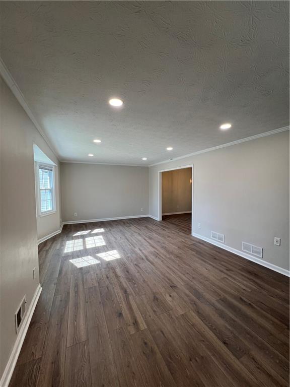 5990 Wellborn Trace Lithonia, GA 30058 - Photo 3 of 56 an empty room with wooden floor and windows