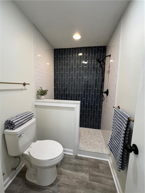 5990 Wellborn Trace Lithonia, GA 30058 - Photo 35 of 56 a bathroom with a toilet and a shower