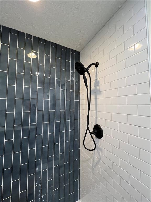 5990 Wellborn Trace Lithonia, GA 30058 - Photo 36 of 56 a bathroom with a shower