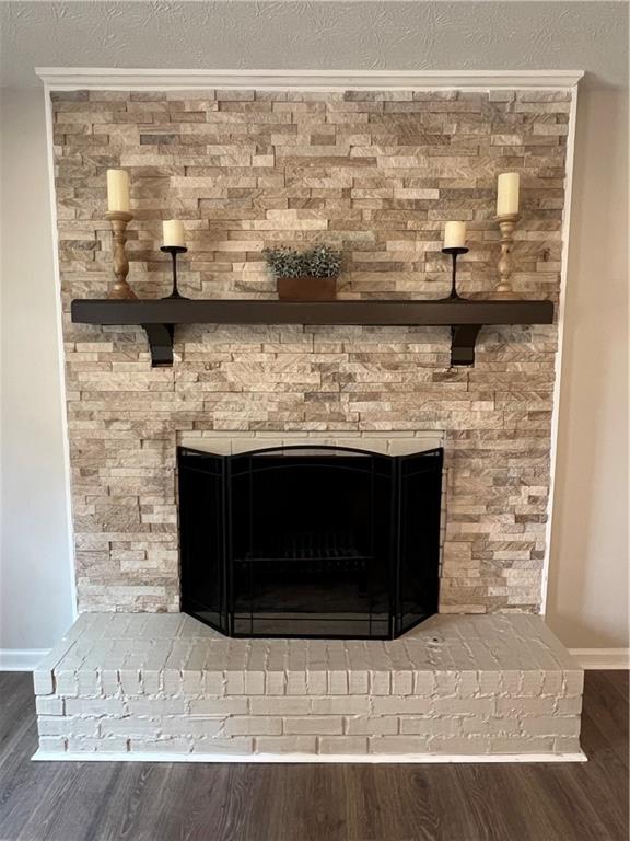 5990 Wellborn Trace Lithonia, GA 30058 - Photo 41 of 56 a room with a fireplace and cabinets