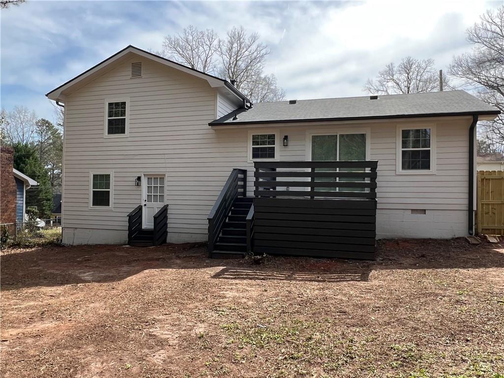 5990 Wellborn Trace Lithonia, GA 30058 - Photo 43 of 56 a view of a house with a yard